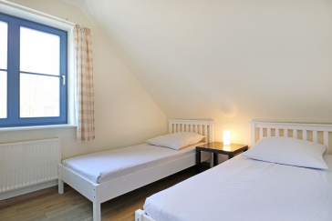 Papillon Whg. Nr. 11/8 - Blick in das Schlafzimmer auf der unterern Wohnebene